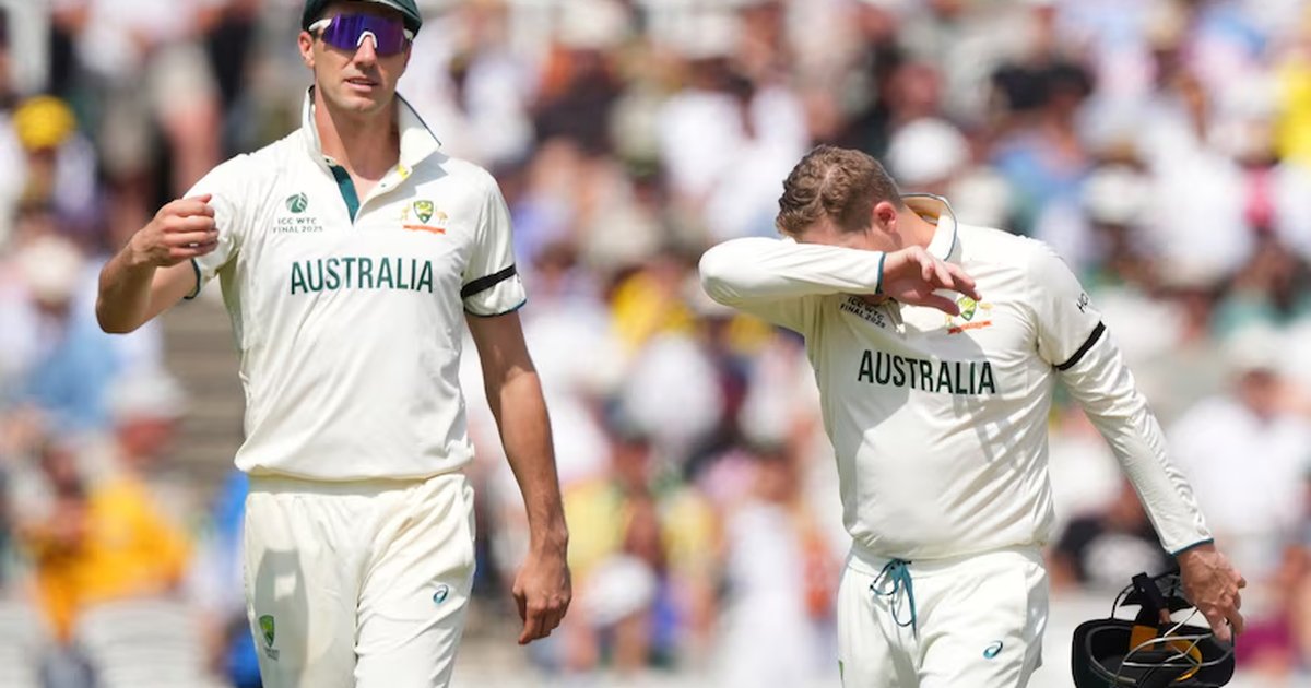 Australian bowler celebrating a wicket with a teammate during a Test match