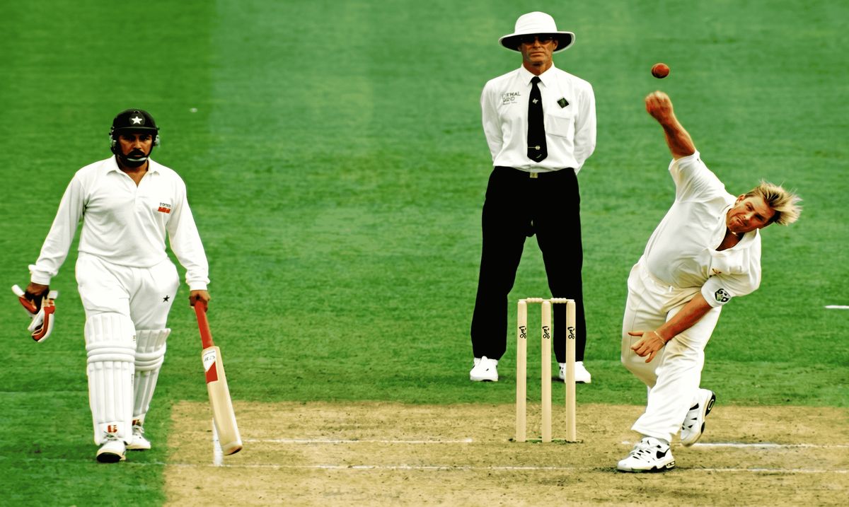 Leg-spinner releasing a googly with wrist turned at delivery